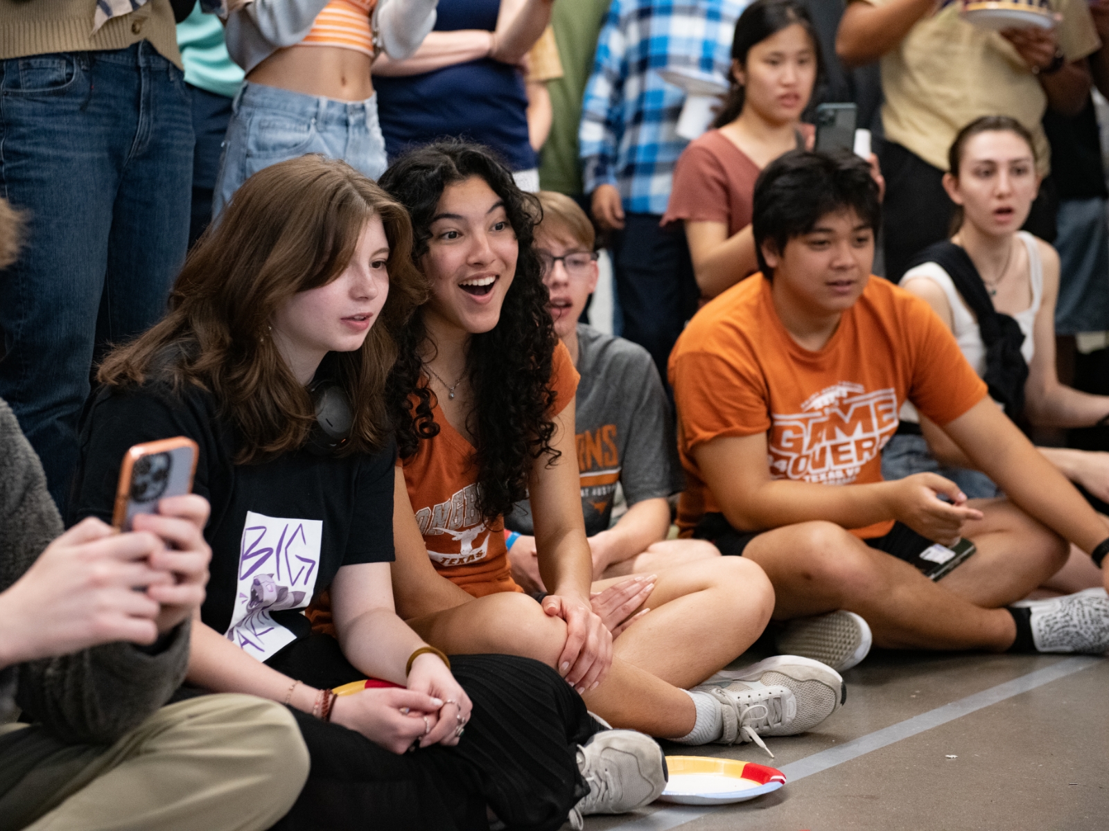 Texas engineering students watching a robot battle