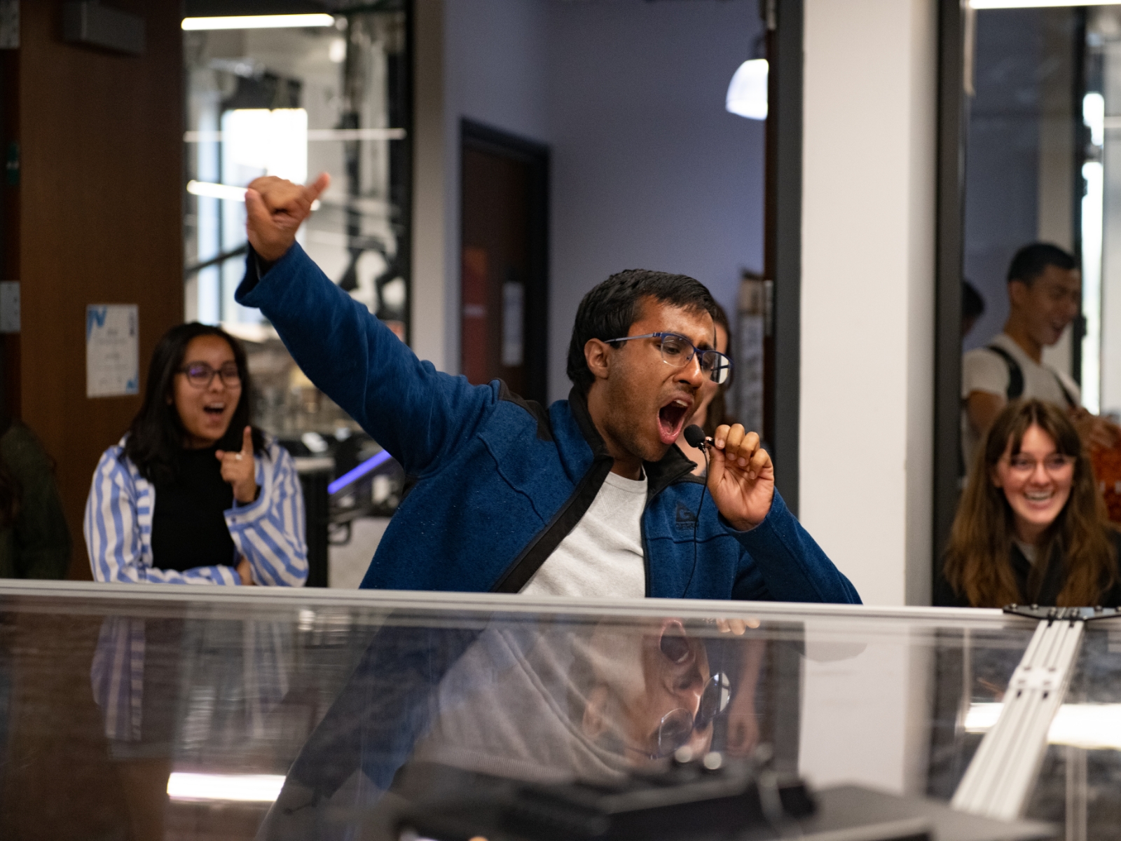 Texas engineering student hyping the crowd at TIW RoboRumble event