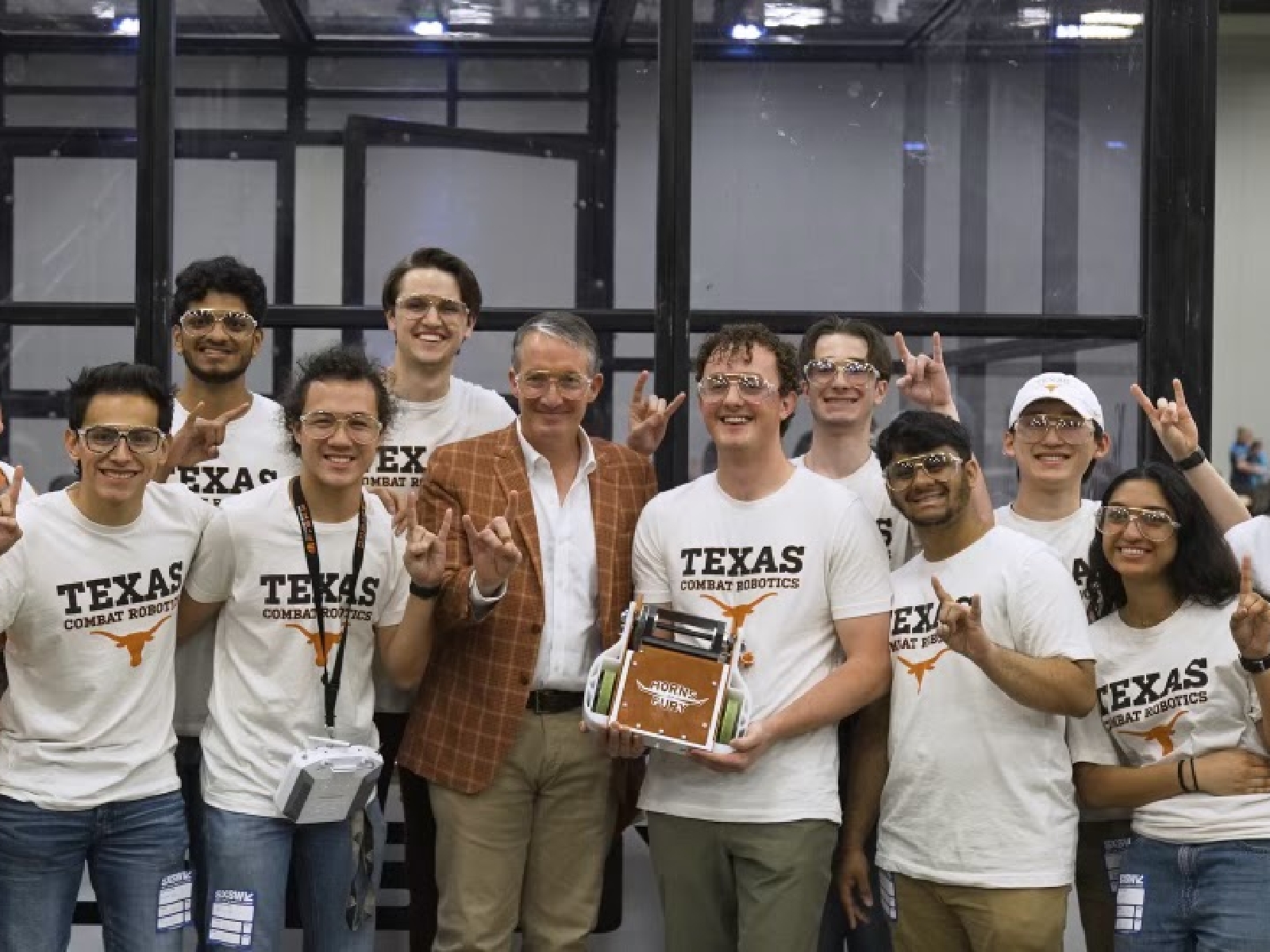 UT Austin President Jay Hartzell and Texas engineering students at Battlebots competition