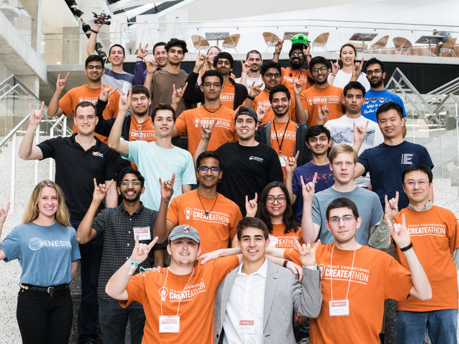 Texas engineering student smiling with a mechanical device on his arm