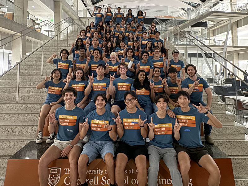 Texas engineering student staff for Texas Inventionworks sitting on steps