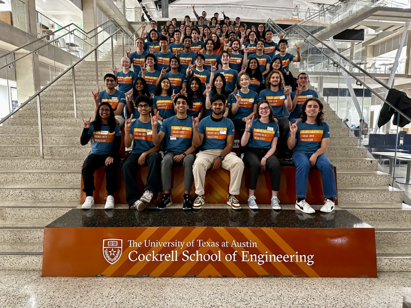 Texas engineering student staff for Texas Inventionworks sitting on steps